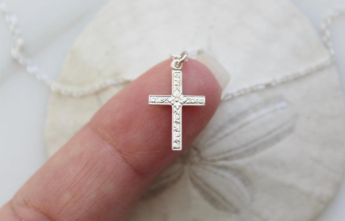 Sterling silver cross pendant necklace with detailed textured cross