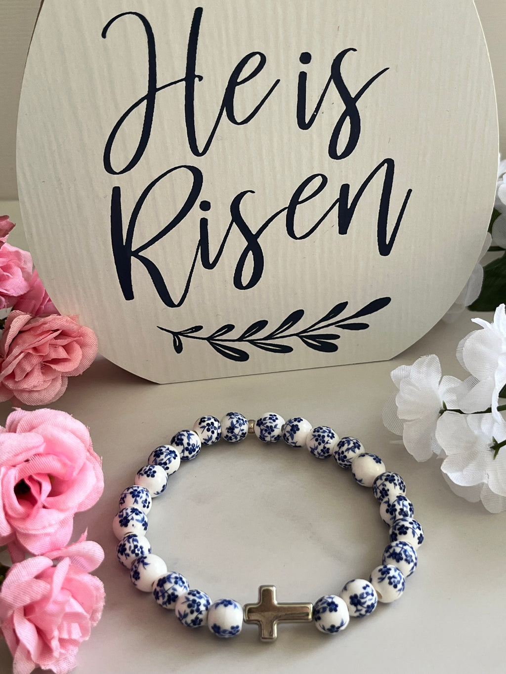 Blue and white beaded cross bracelet with silver cross charm