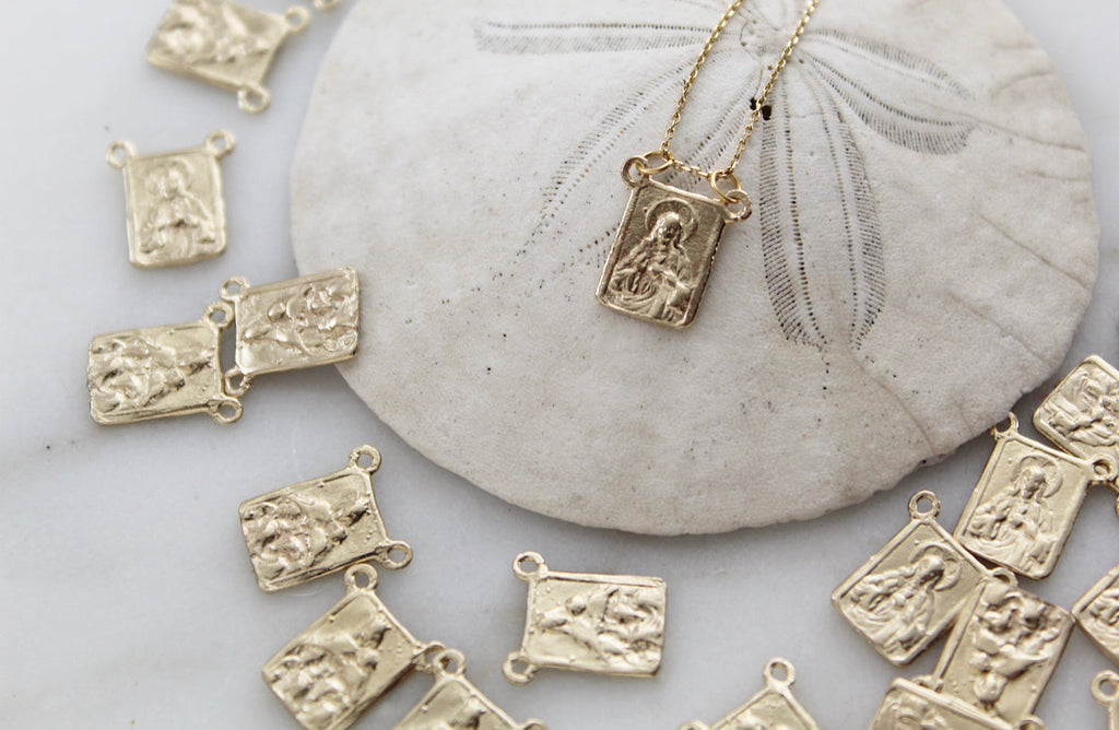 14k gold scapular necklace with small rectangular saint pendant charms on chain