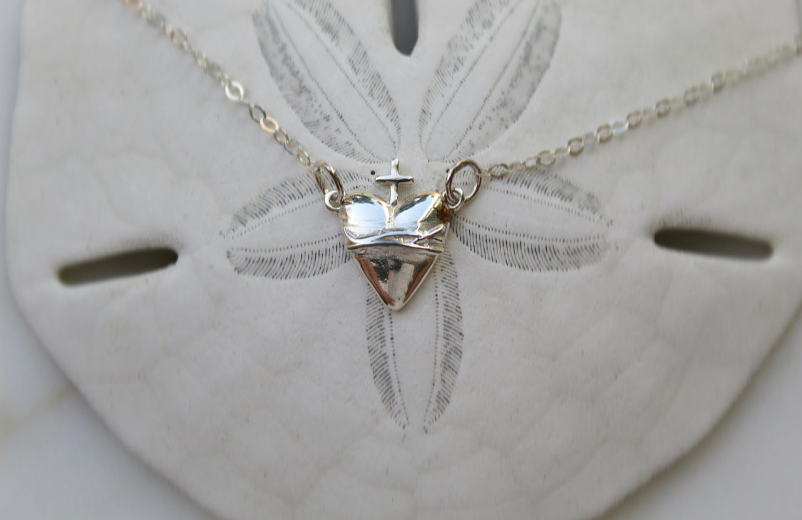 Sterling silver heart pendant with cross and chain, front view