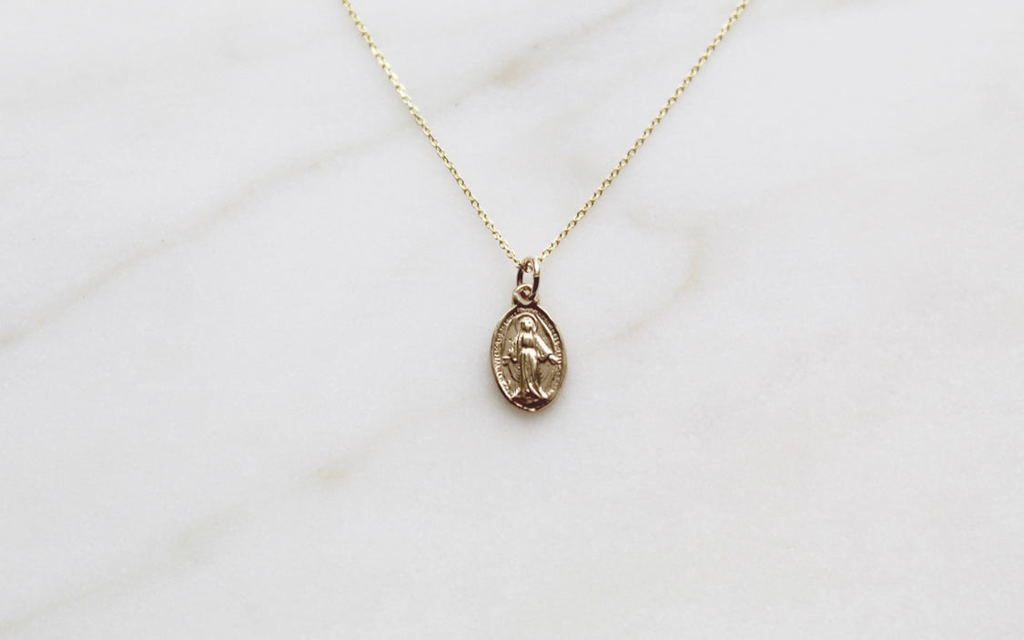 14k gold medal necklace with oval Miraculous pendant on thin chain