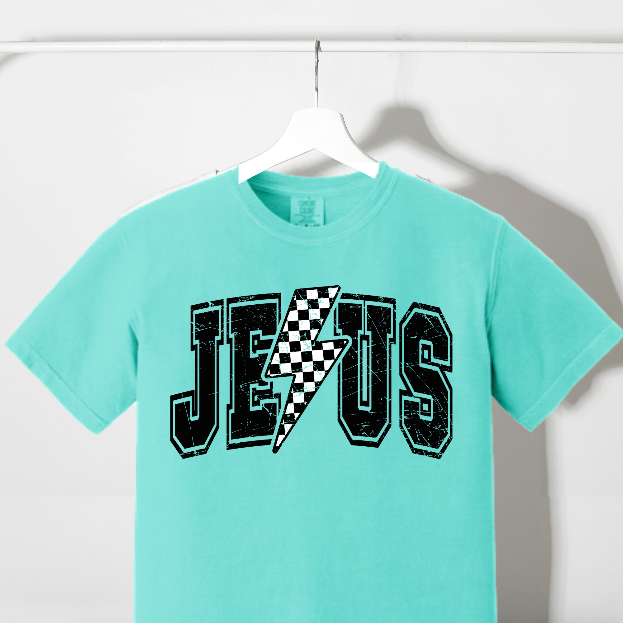 Teal crew-neck T-shirt with checkered lightning bolt front graphic