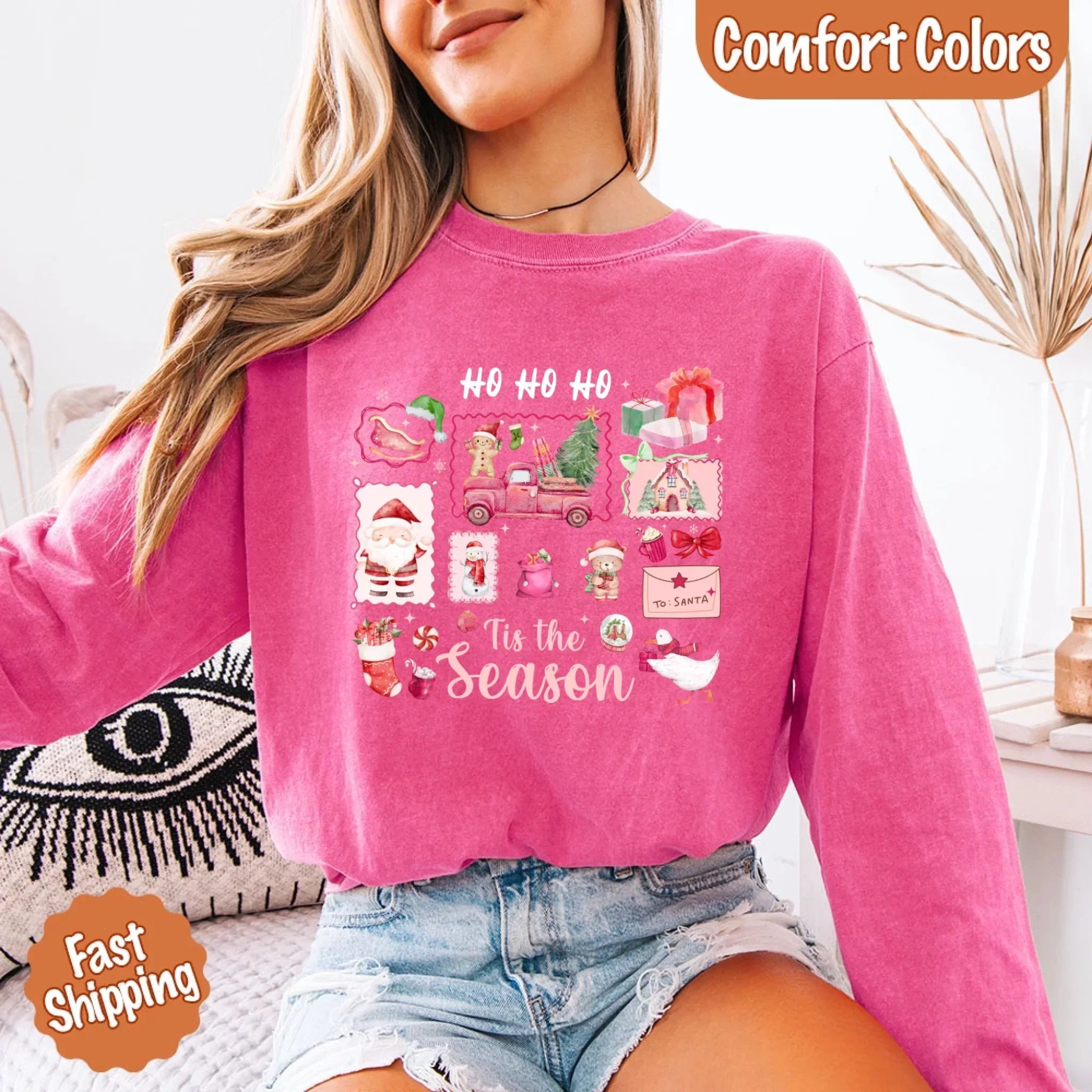 Pink long-sleeve Christmas T-shirt with “HO HO HO” and “Tis the Season” graphic