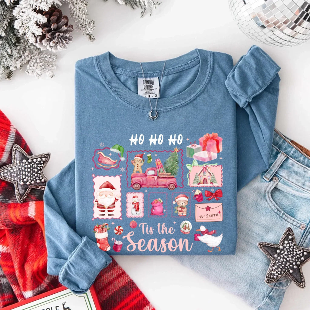 Light blue long-sleeve Christmas T-shirt with “HO HO HO” and “Tis the Season” graphic
