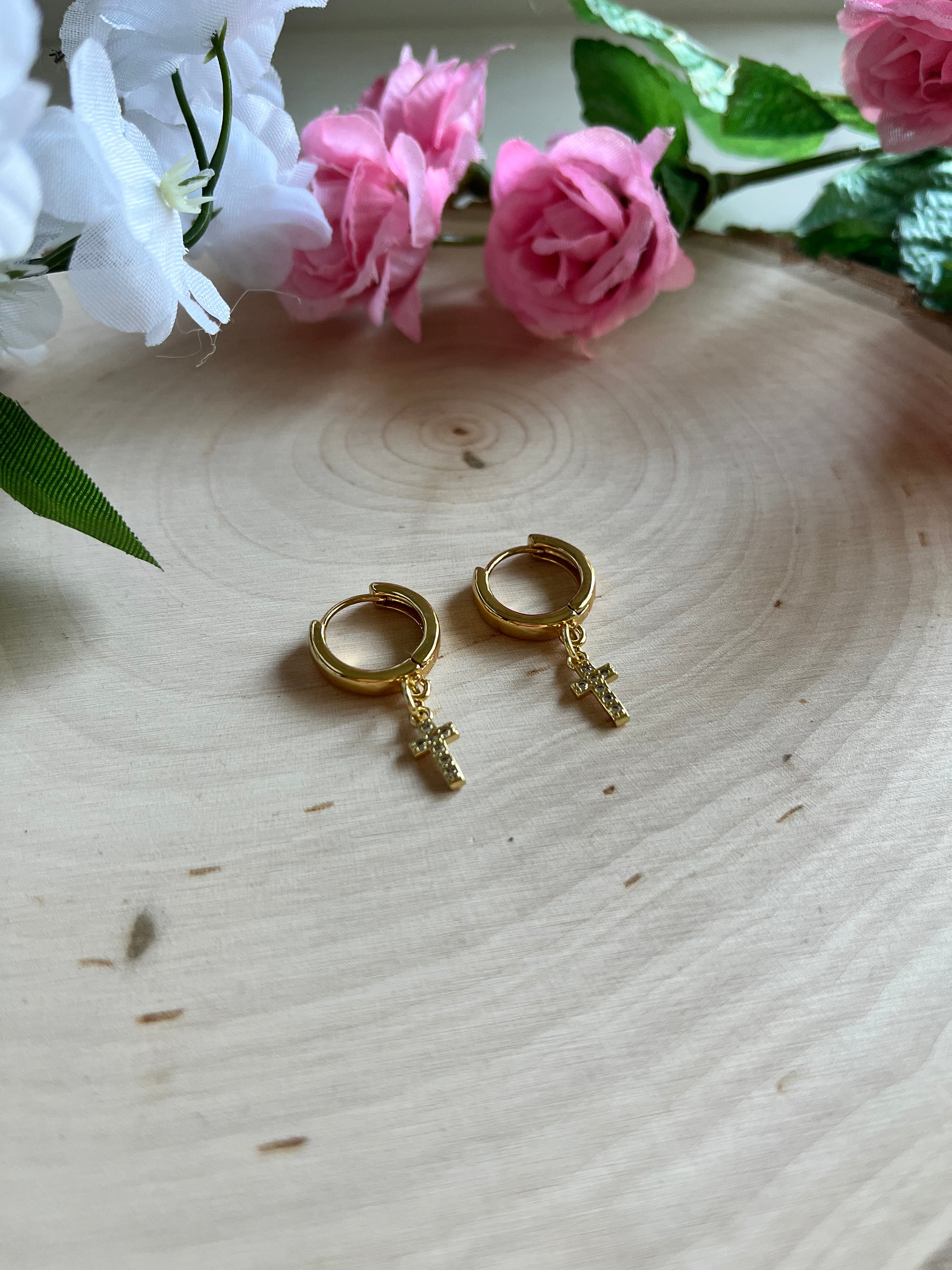 Gold hoop cross earrings with small cross charm dangles