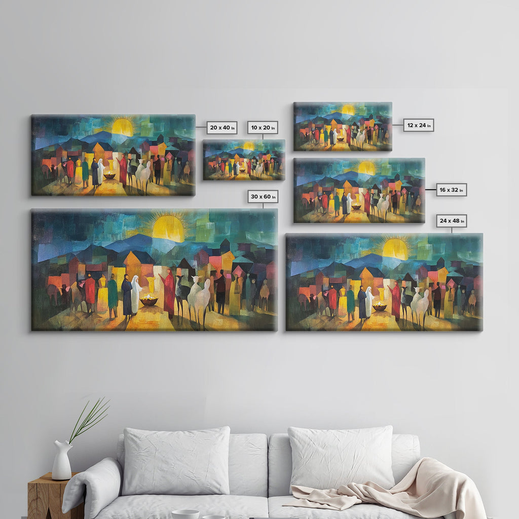 Set of framed nativity scene prints in multiple sizes shown on a living room wall