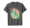 Dark gray T-shirt with colorful bunny riding green dinosaur over soccer balls