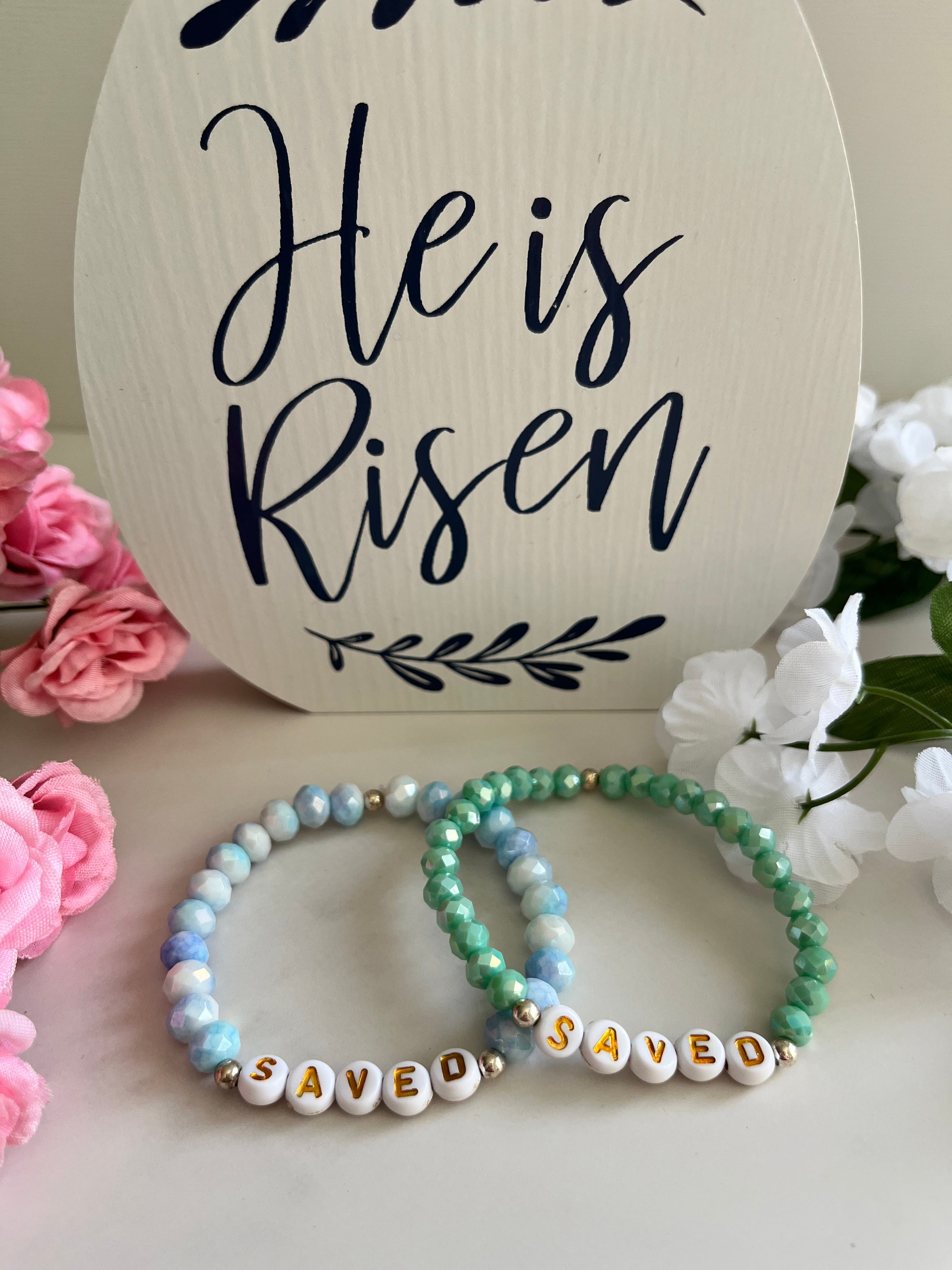 Mint and light blue beaded bracelets with gold accents and 'SAVED' letter beads