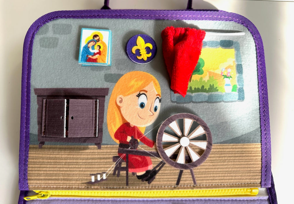 Busy book page with fairytale cottage scene, red hair character, and spinning wheel detail