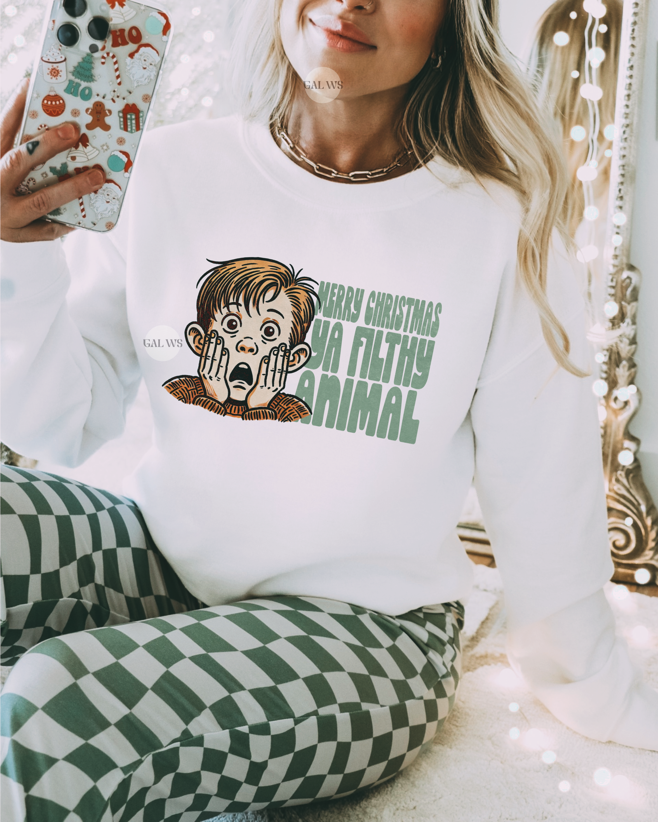 White crewneck sweatshirt with printed cartoon dog and "Filthy Animal" text on front.