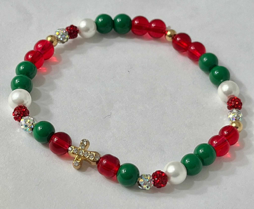 Bead bracelet with red, green, and white beads and a gold jeweled cross charm