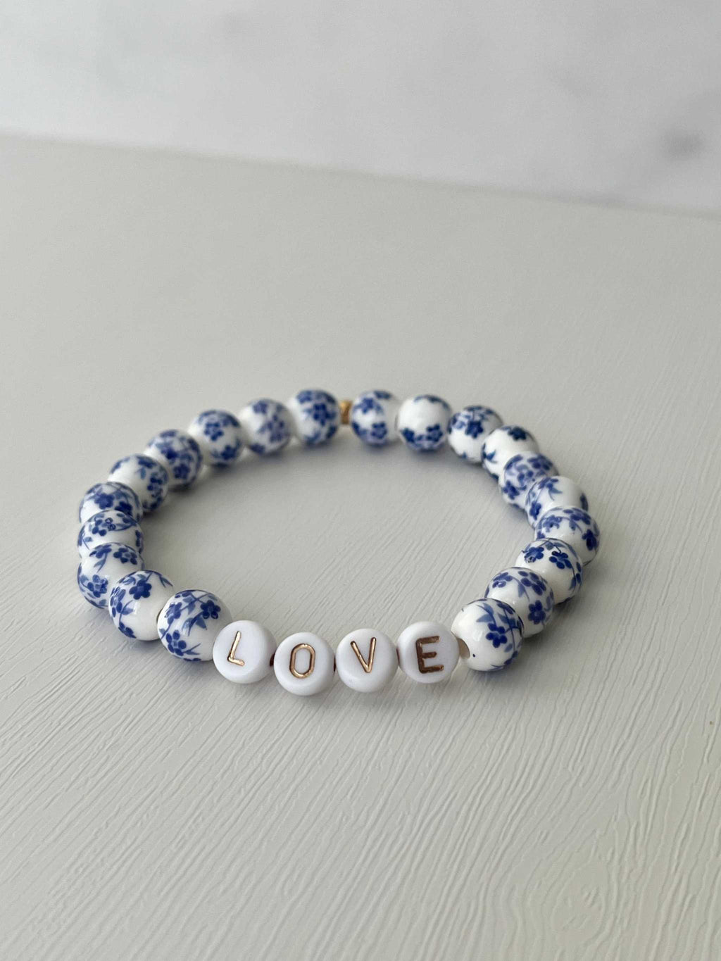 Floral bead bracelet with ceramic letter beads spelling LOVE