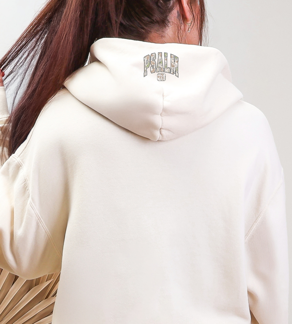 White hoodie back with small 'Psalm' logo near hood