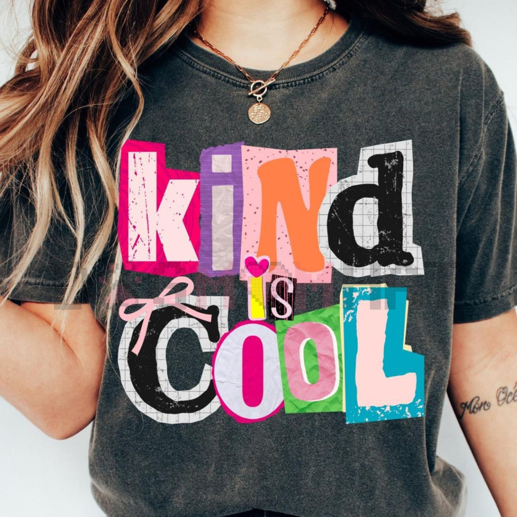 Dark heather gray T-shirt with bold colorful “Kind is Cool” layered text graphic