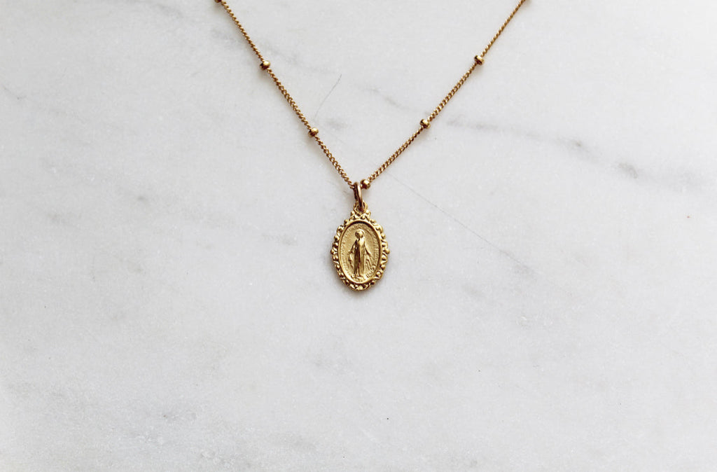 Gold-tone chain necklace with oval Miraculous medal pendant