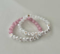 Pink and white beaded bracelet with faceted crystals and 'I AM LOVED' beads