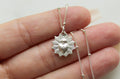 Sterling silver heart pendant necklace with scalloped frame, on a fine chain