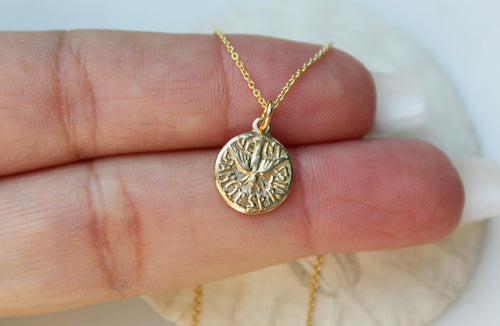 14k gold Holy Spirit necklace with round textured pendant on thin chain