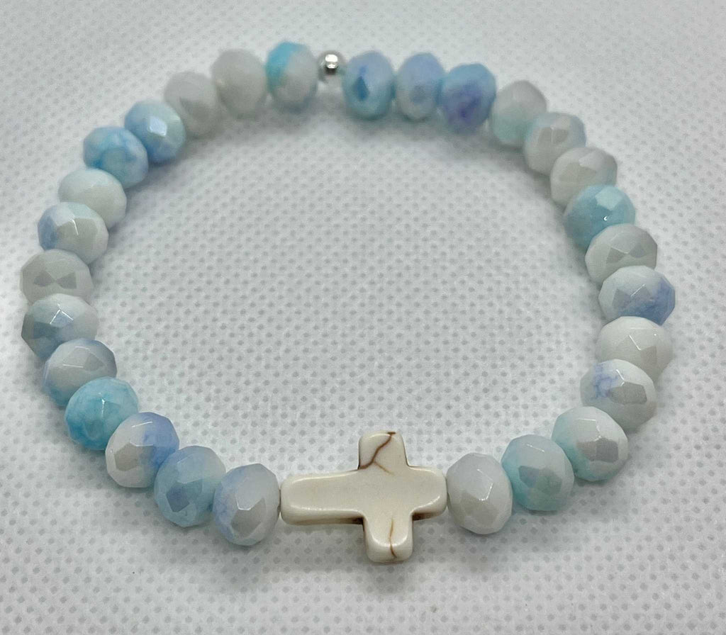Light blue faceted bead cross bracelet with white cross charm