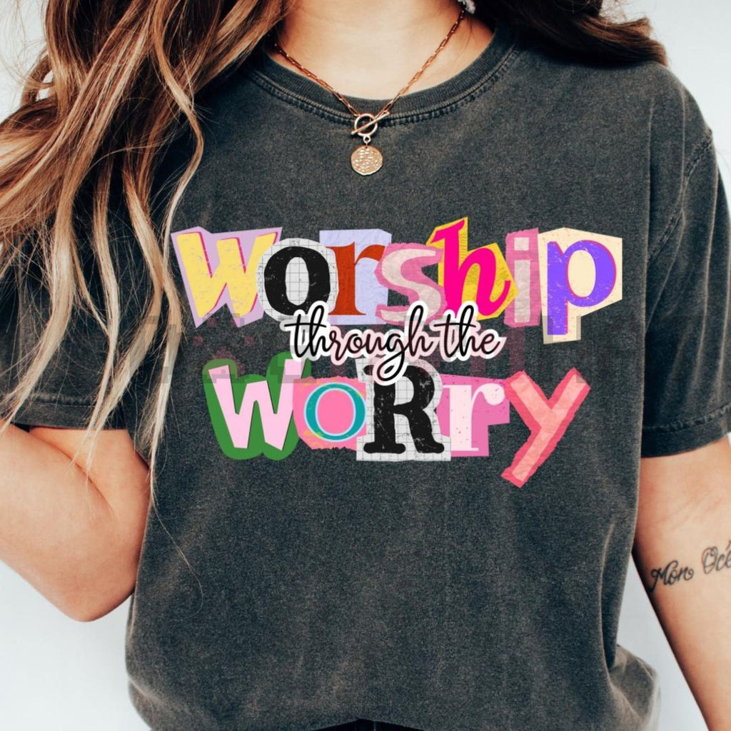 Dark heather gray T-shirt with “Worship through the Worry” multicolor typographic graphic