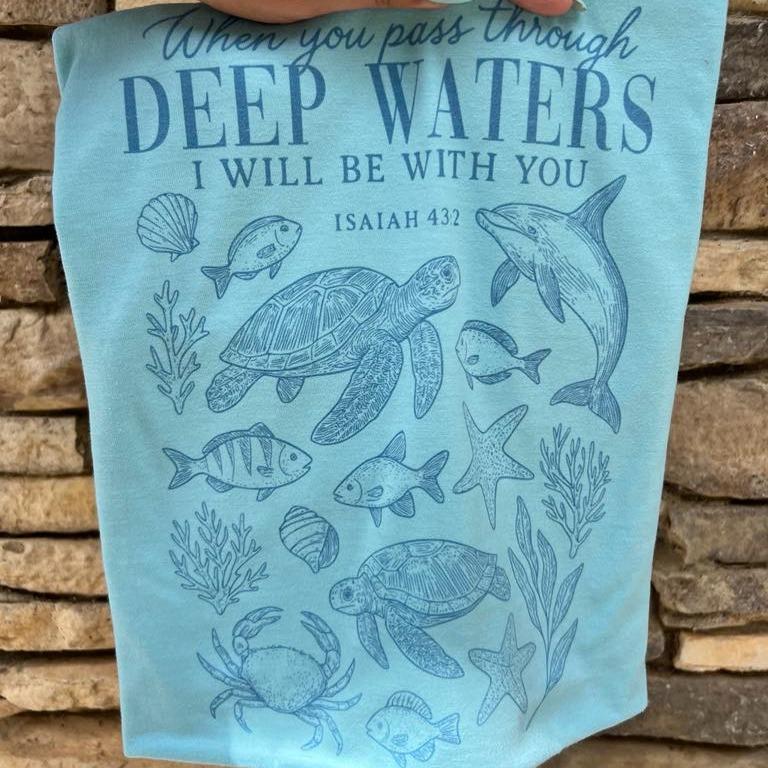 Seafoam blue-green Christian T-shirt with fish line-art and 'DEEP WATERS' verse