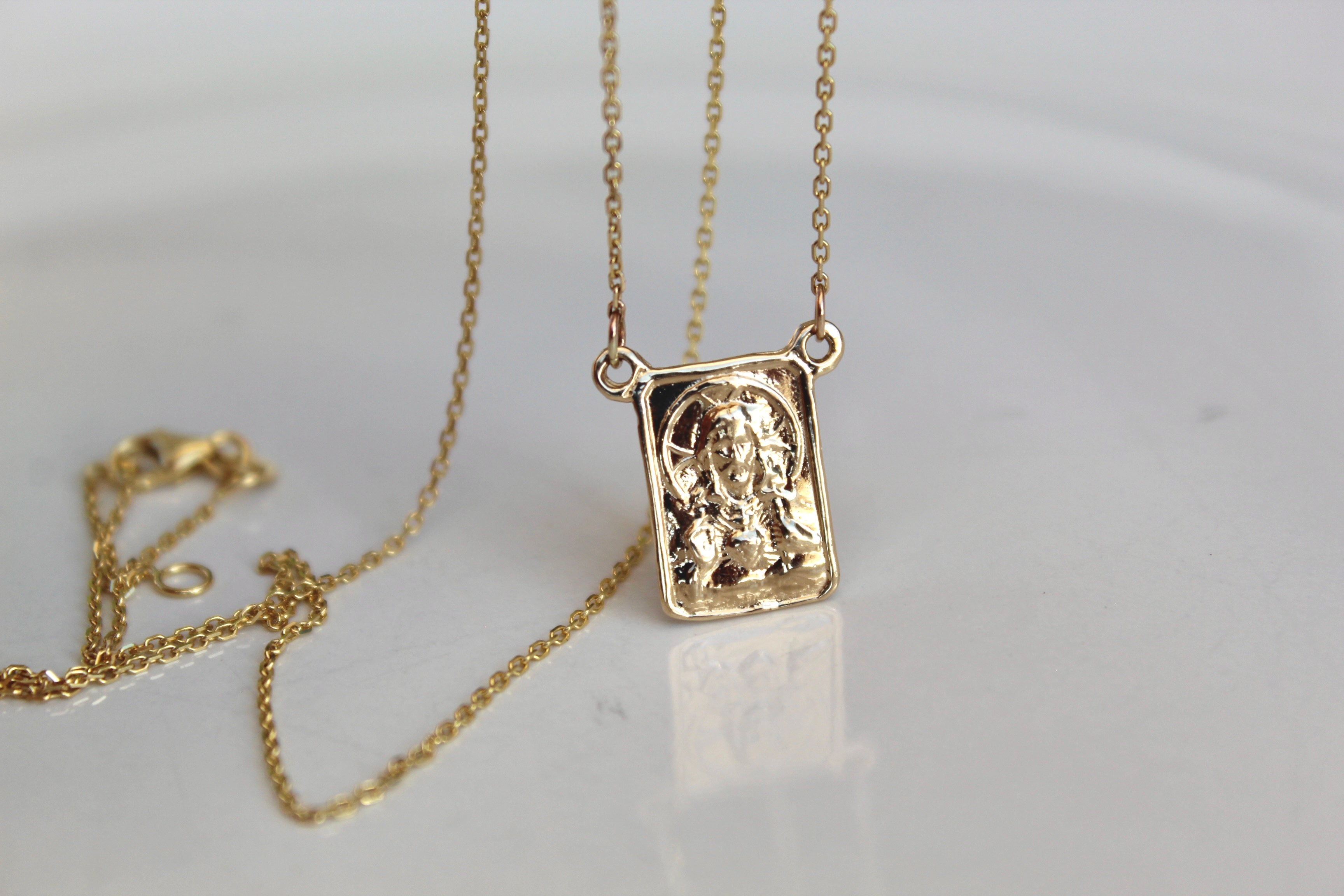 14K gold scapular pendant necklace with square saint portrait charm and layered chains