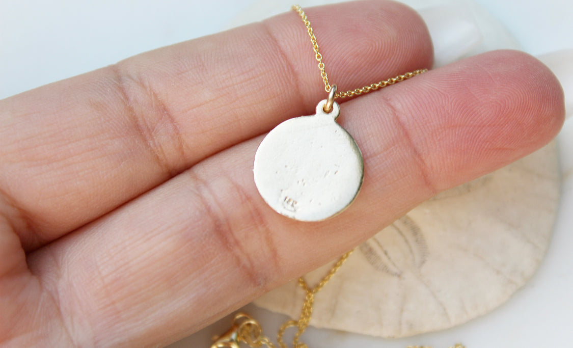 14k gold pendant necklace with round plain back medallion on gold chain