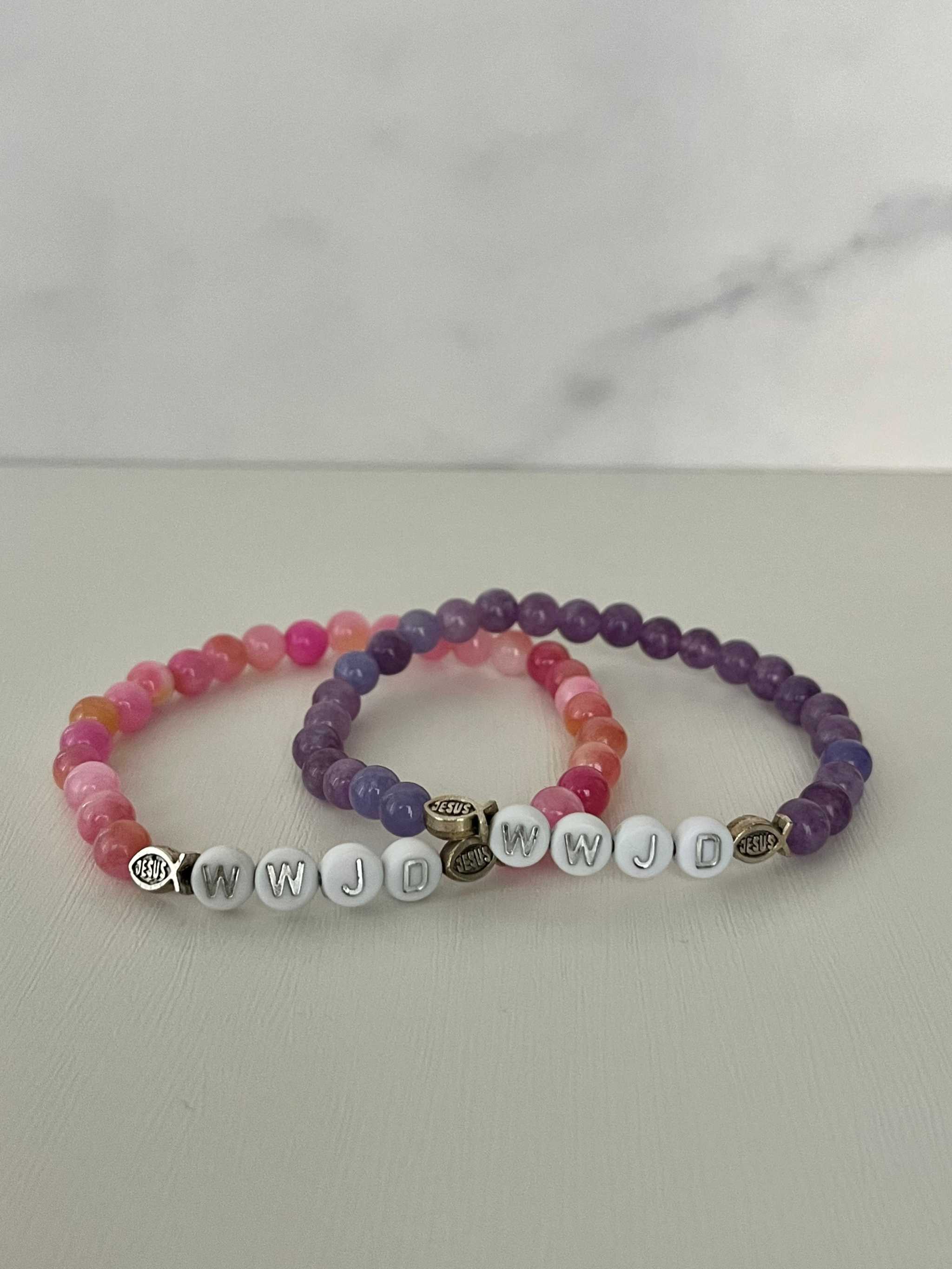 Stacked bead bracelets: purple and pink natural stone with WWJD letter beads