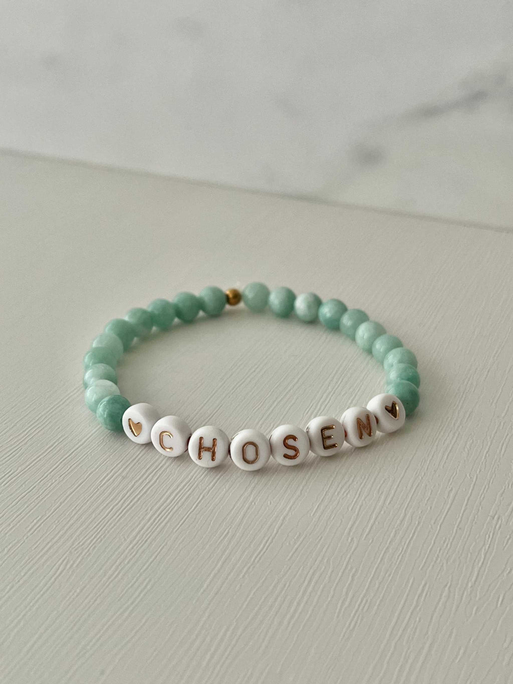 Jade green bead bracelet with white CHOSEN beads and small gold accent
