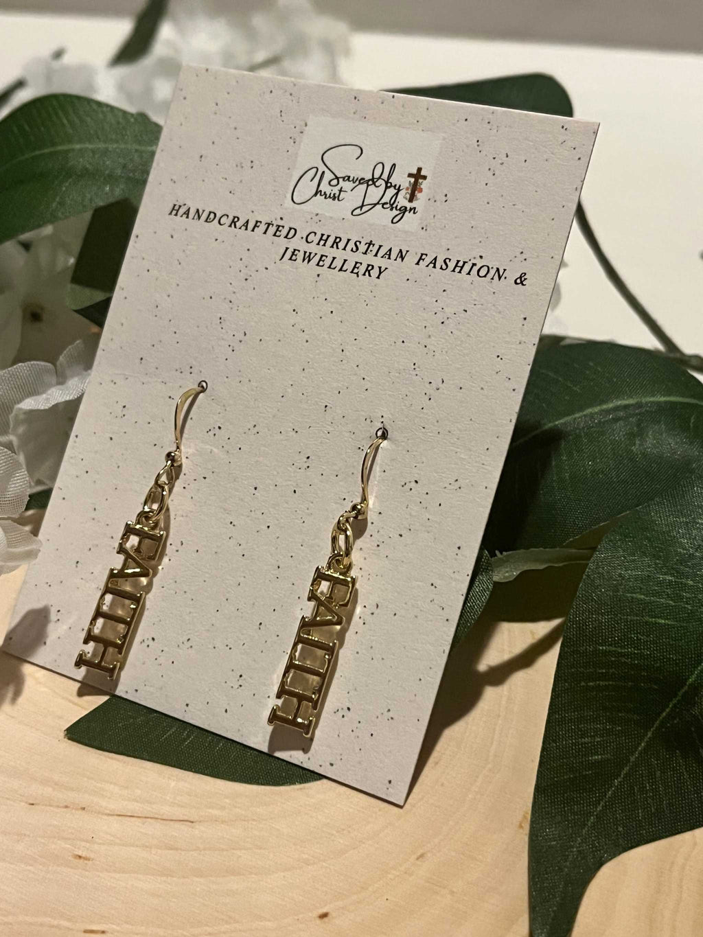 14K gold faith dangle earrings with FAITH block lettering on hinged drops