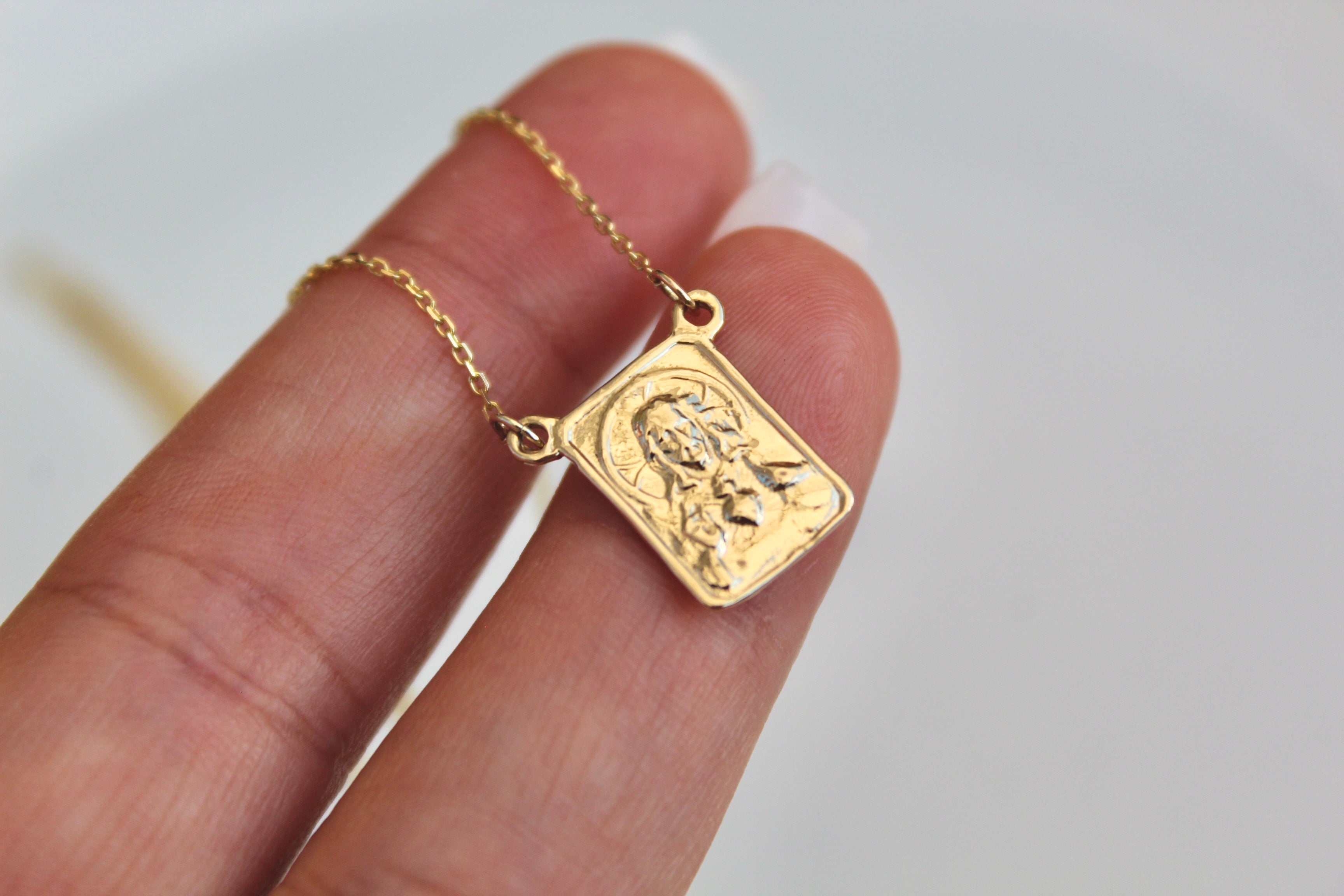 14K gold scapular pendant with engraved rectangular center and small hanging chain