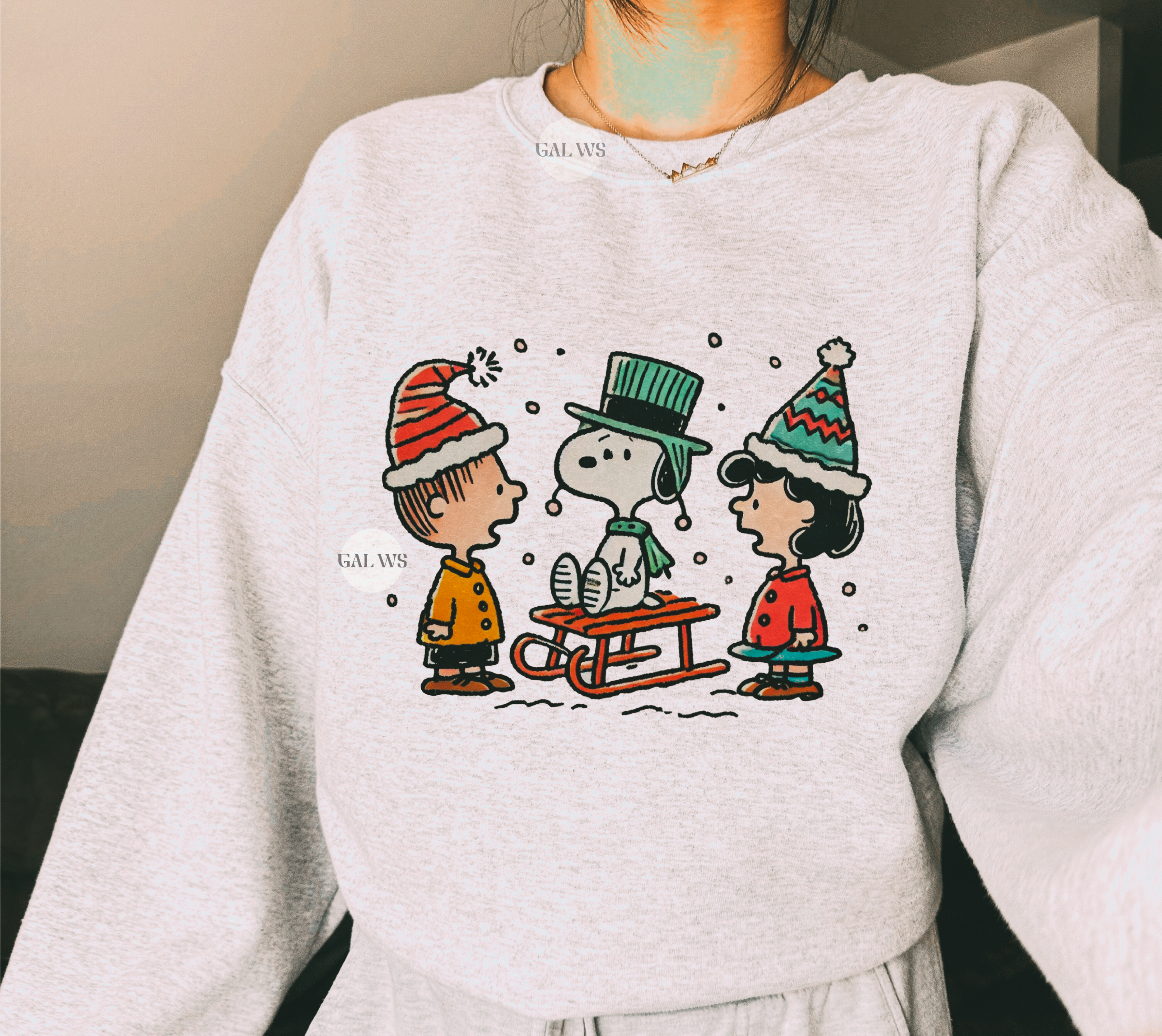 Light gray crewneck sweatshirt with colorful vintage Christmas graphic across chest