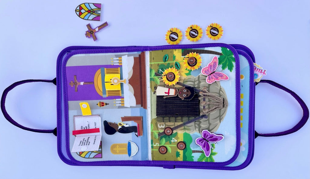 Busy book open page with illustrated city scene, butterfly and flower felt decorations