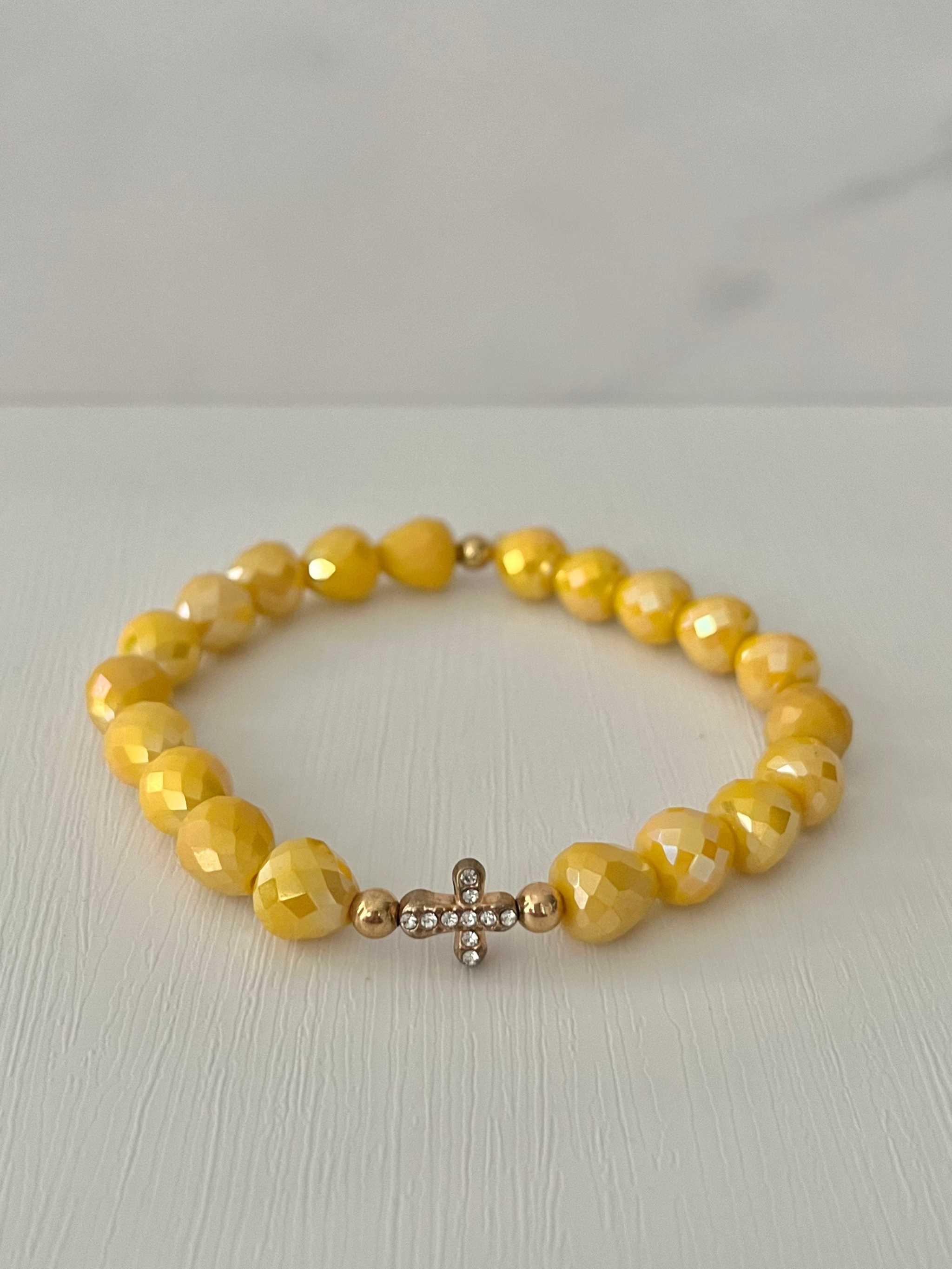 Beaded cross bracelet with yellow faceted beads and rhinestone cross charm