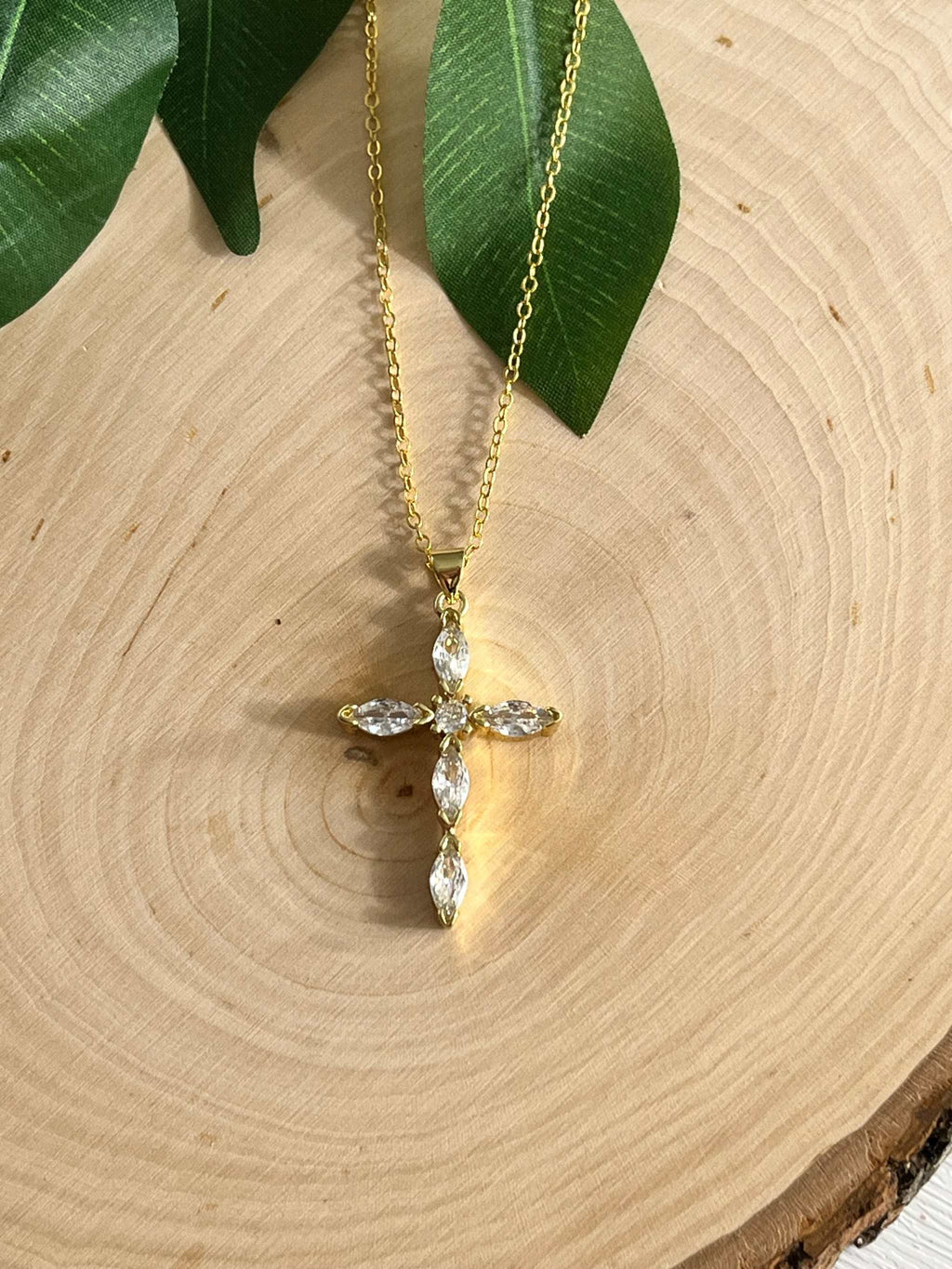 Gold cross pendant necklace with clear crystal stones and extended chain