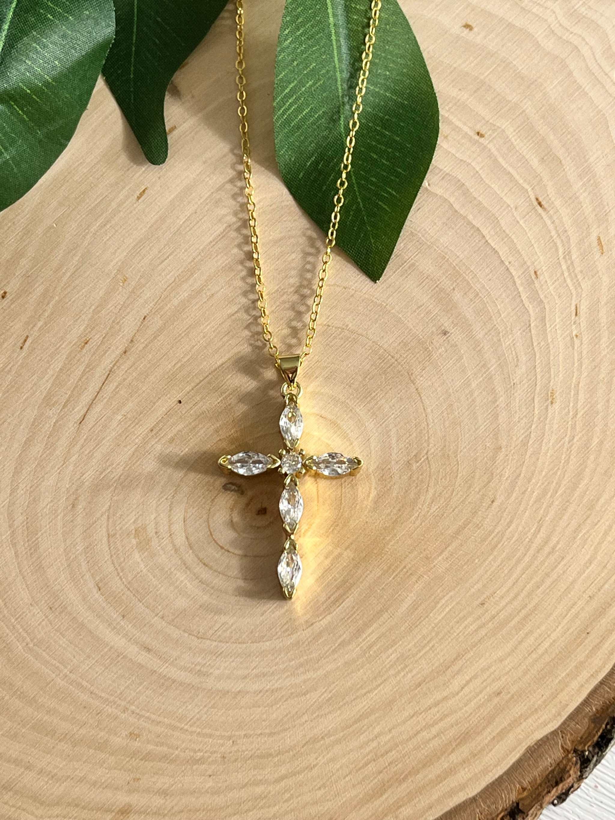 Gold cross pendant necklace with clear crystal stones and extended chain