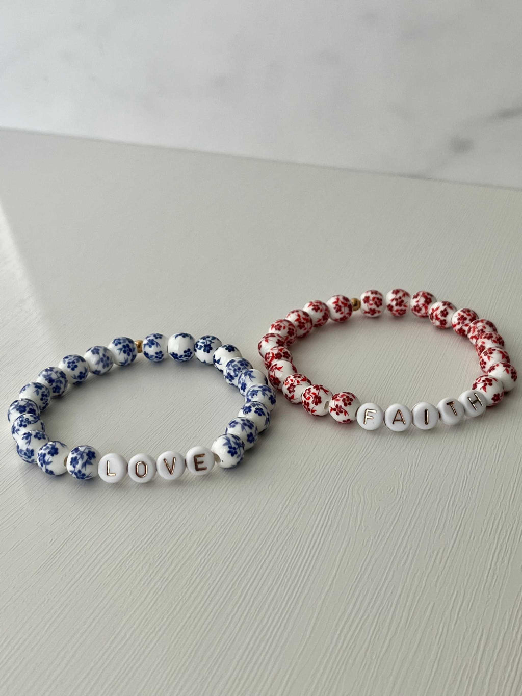 Bead bracelet set with LOVE and FAITH ceramic letter charms, floral beads