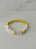 Bead bracelet with white letter beads and yellow round beads, JESUS IS KING