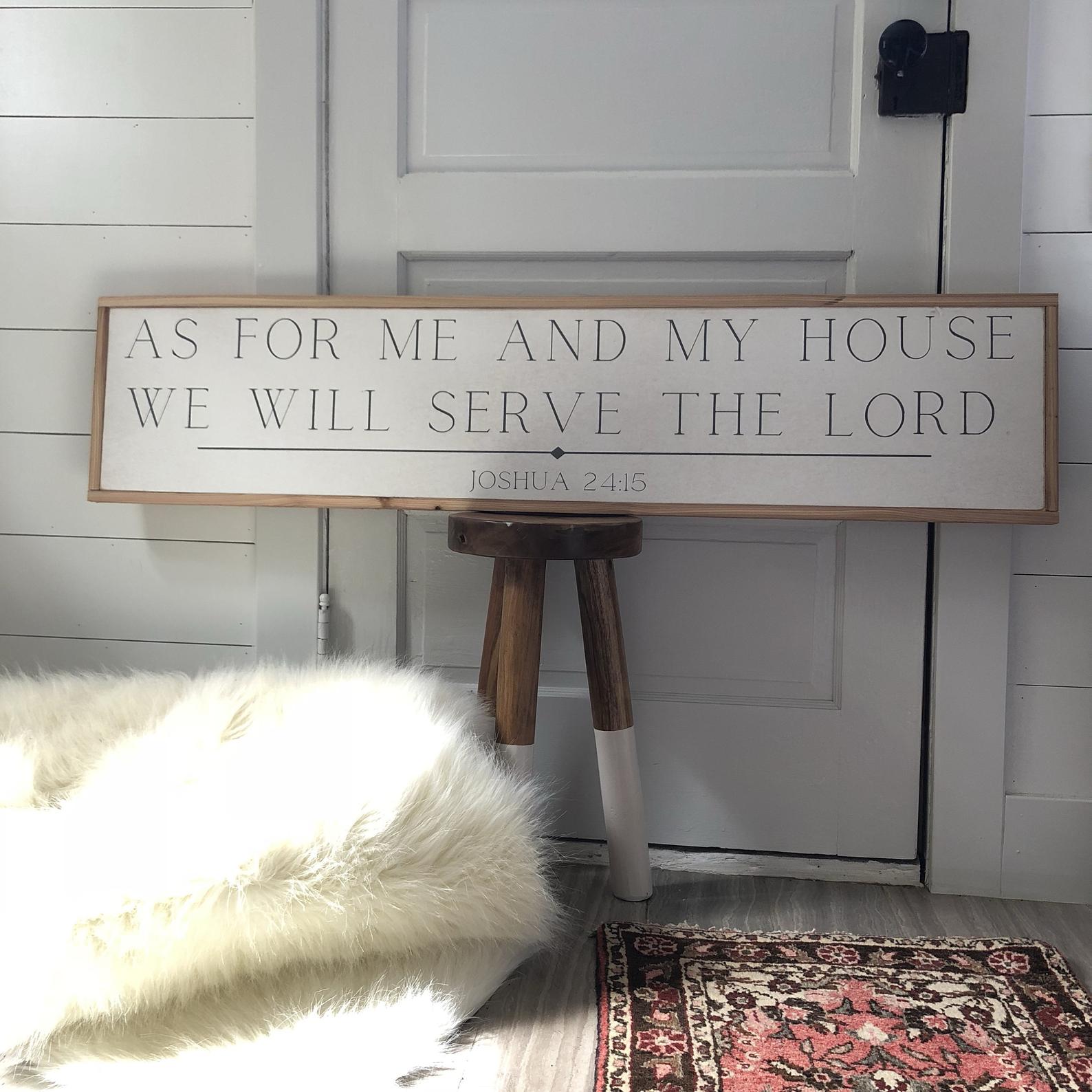 Wood farmhouse sign with 'As for me and my house...' and 'Joshua 24:15'.