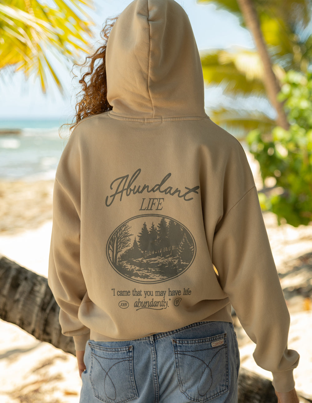 Beige unisex hoodie, back view with circular graphic and slogan