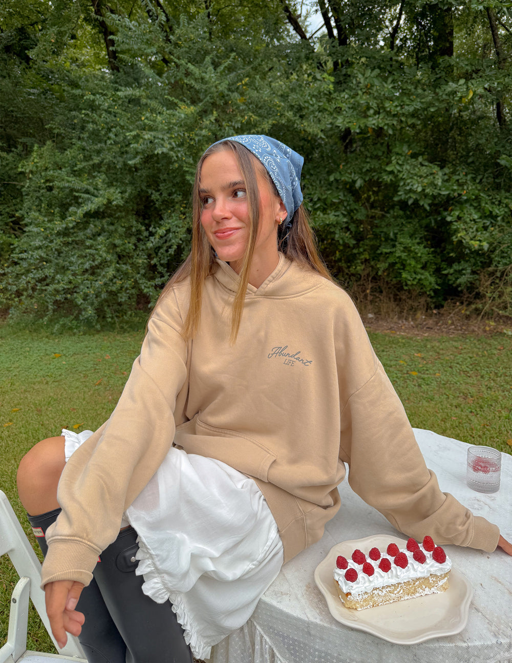 Beige unisex hoodie with front kangaroo pocket and small chest logo
