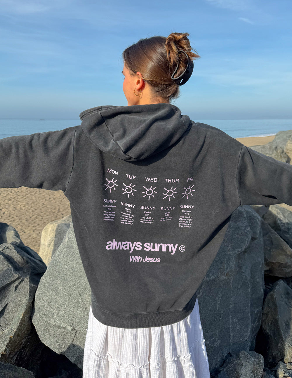 Unisex charcoal hoodie with back graphic sun icons and “always sunny” text, relaxed fit