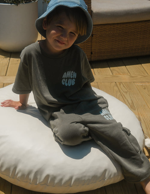 Kids cargo sweatpants in olive with front logo print and side cargo pocket