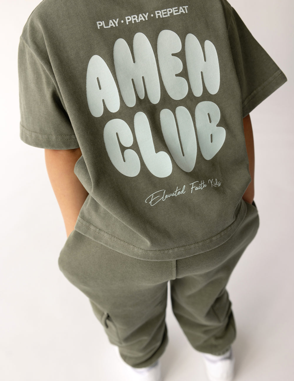 Kids graphic T-shirt in olive green, large AMEN CLUB back logo