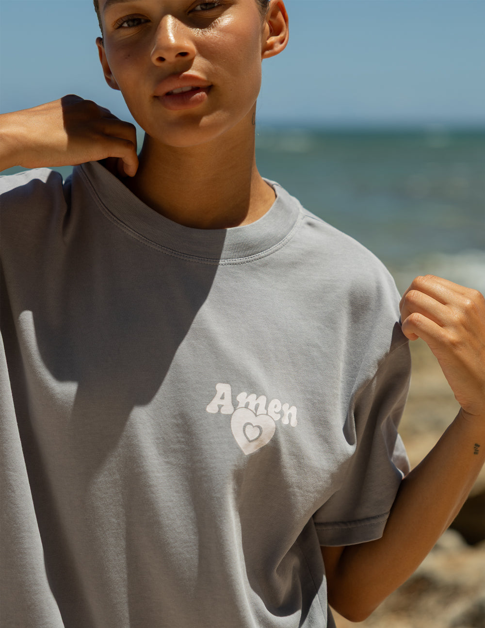 Light gray unisex tee, Amen logo patch on front