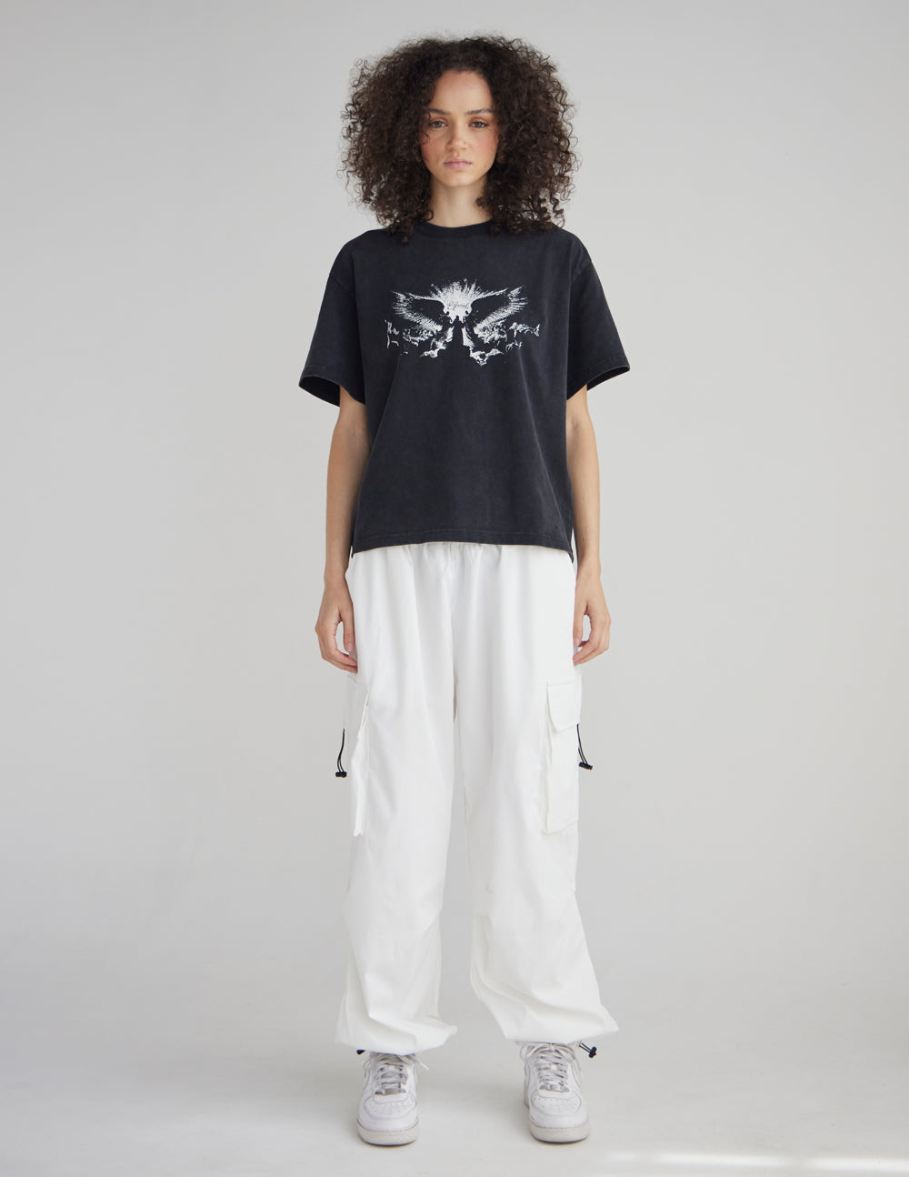 Black heavyweight T-shirt with white winged angel graphic, crew neck style