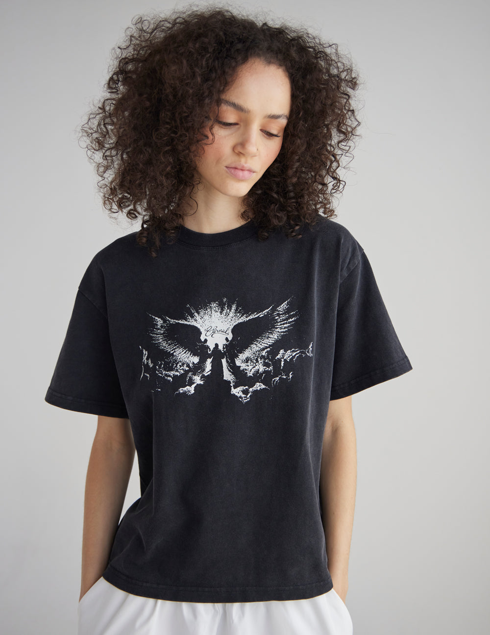 Black heavyweight T-shirt with white winged angel graphic, short sleeves