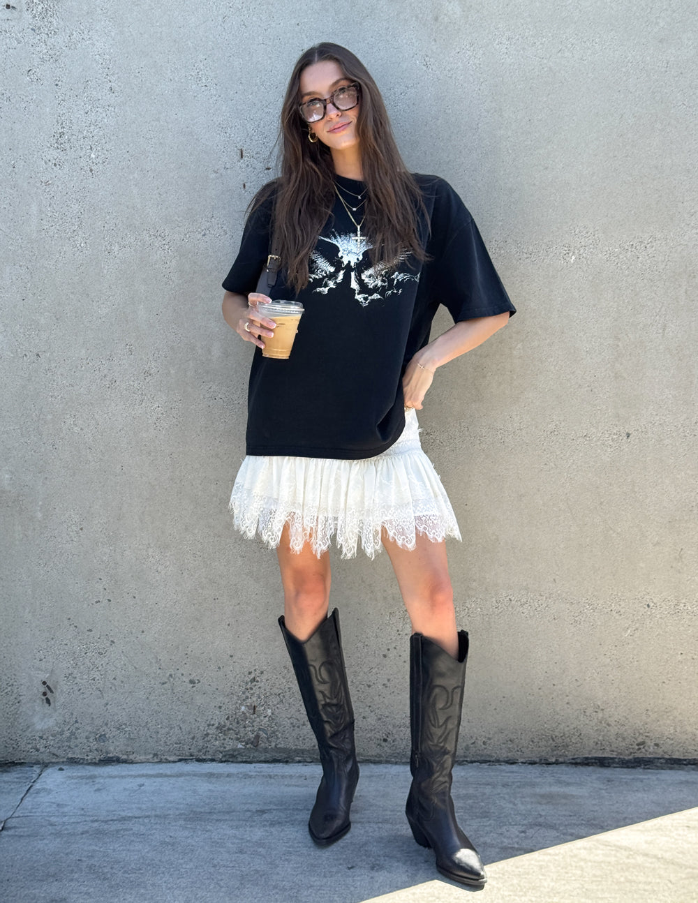 Black heavyweight T-shirt with large white winged angel graphic on front