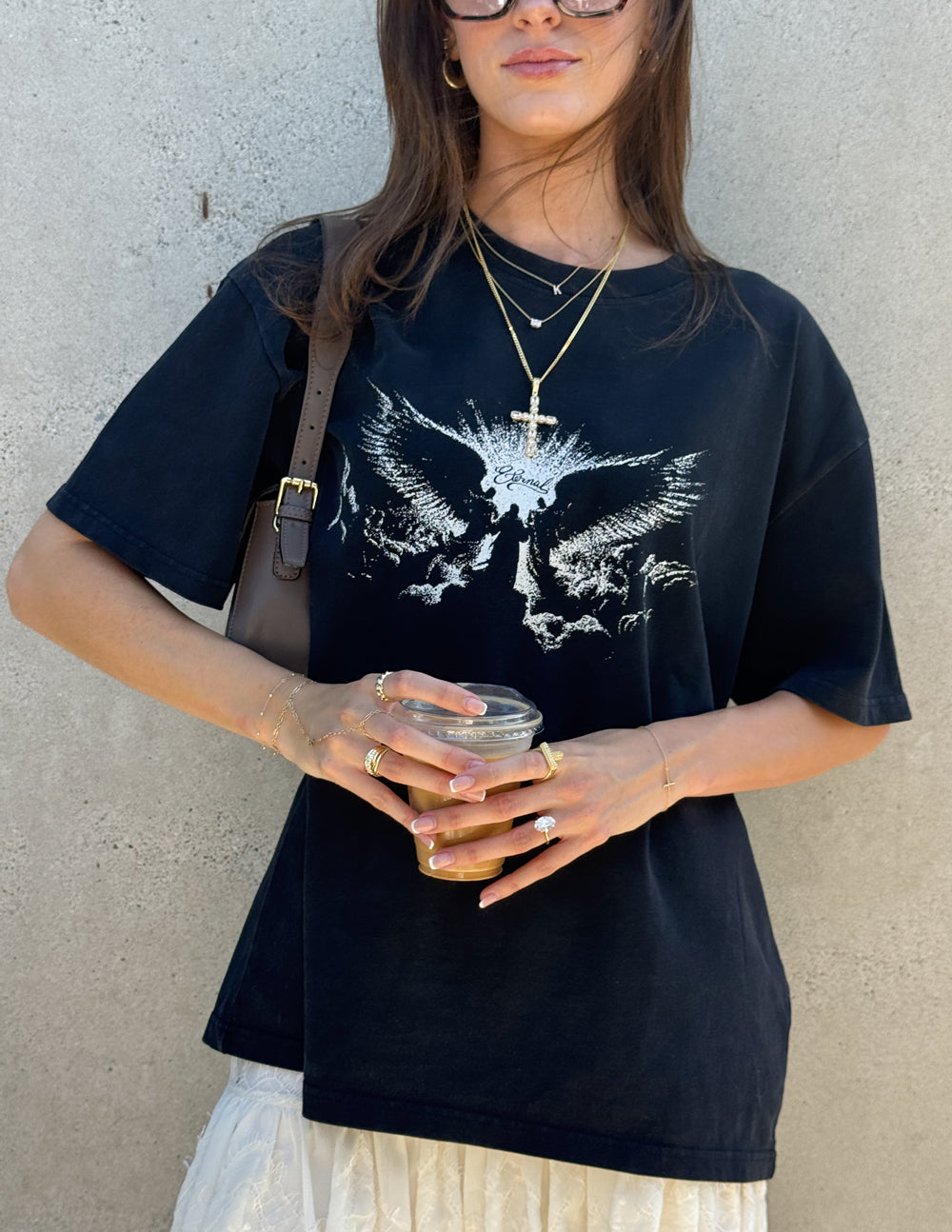 Black heavyweight T-shirt with white winged angel graphic and crew neckline