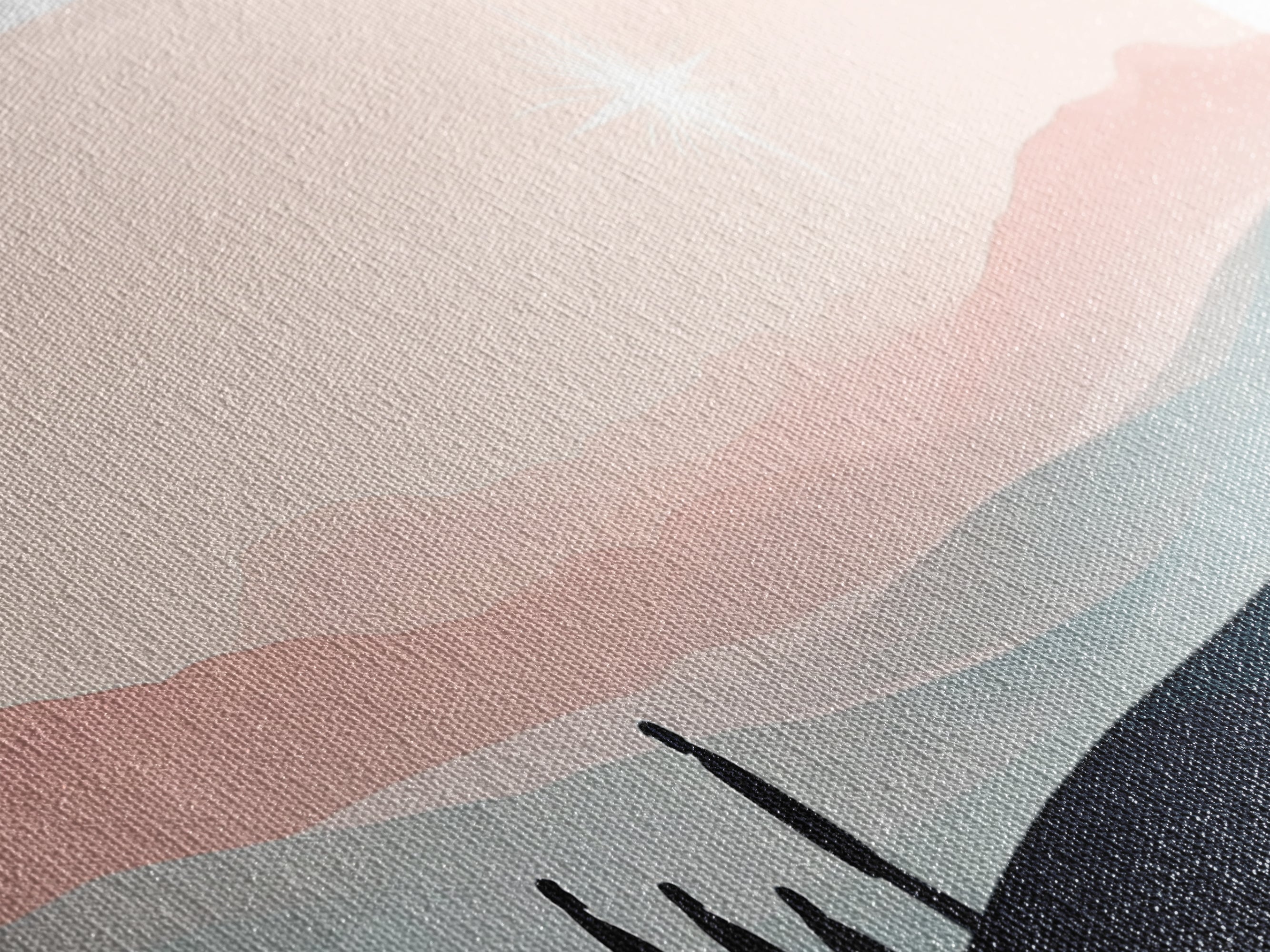 Close-up of woven canvas texture with pink sky tones and a dark horizon silhouette